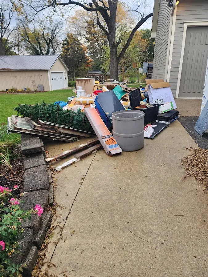 Dumpster being loaded with debris for 3 Yard Dumpster Rental in North Mankato